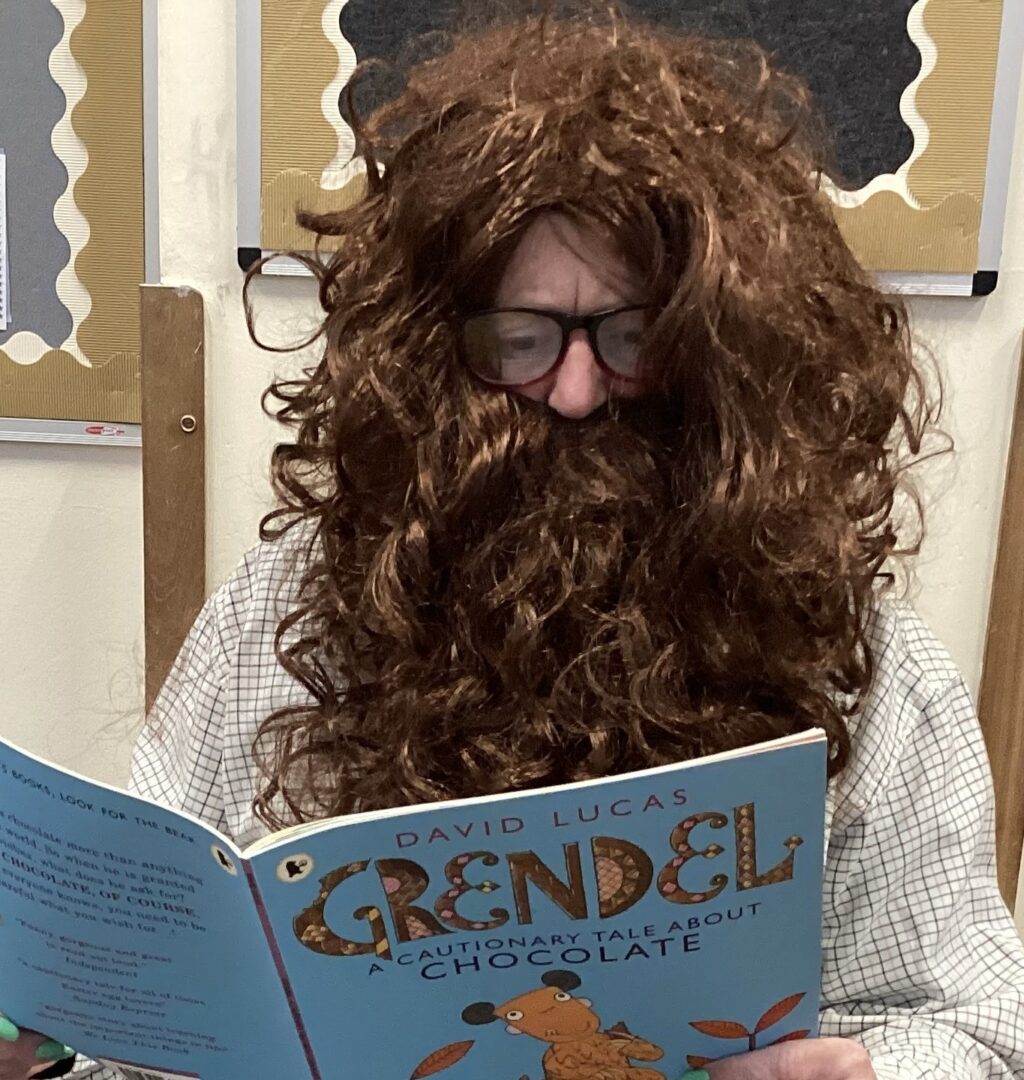 GANF Teacher dresses as a mystery reader